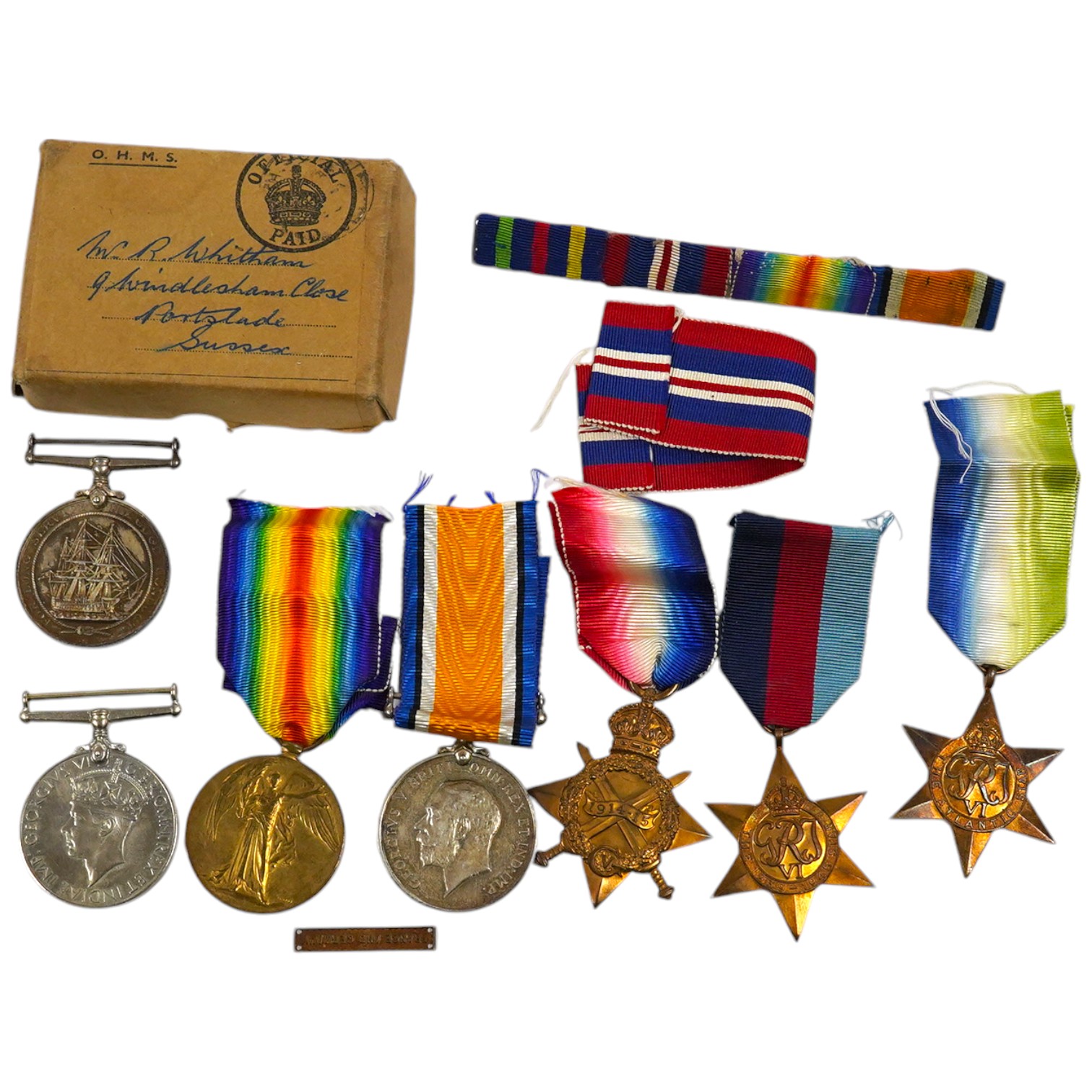 A WWI and WWII medal group awarded to R. Whitham A.B. R.N.; a First World War medal trio with a George V Long Service and Good Conduct Medal, together with a 1939-1945 Medal, the Atlantic Star, and the 1939-1945 Star. Co